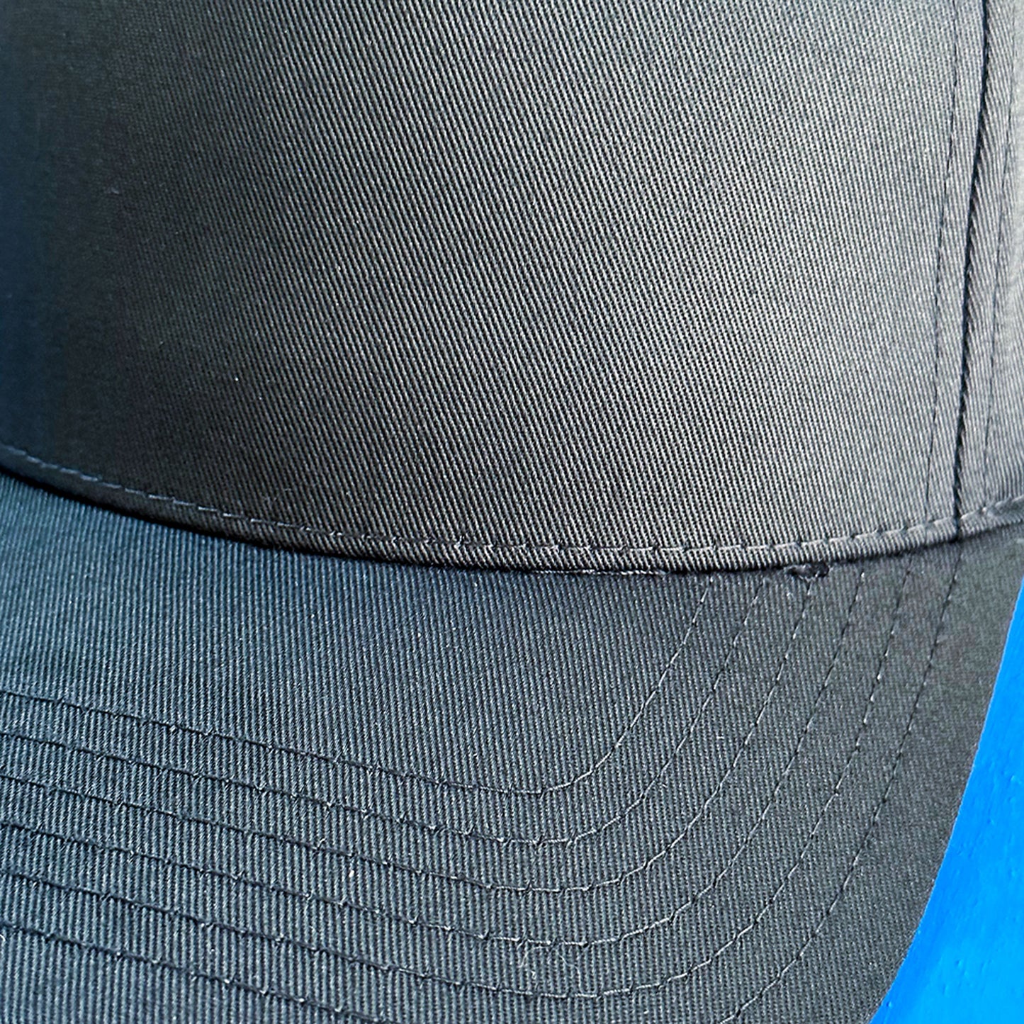 gift for surfer hat with text and logo personalized. Close up on the hat's brim